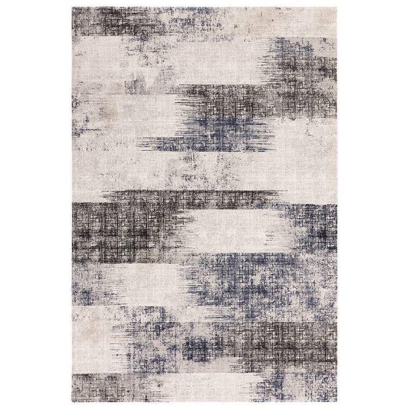 modern area rug with abstract grey and navy pattern on cream background