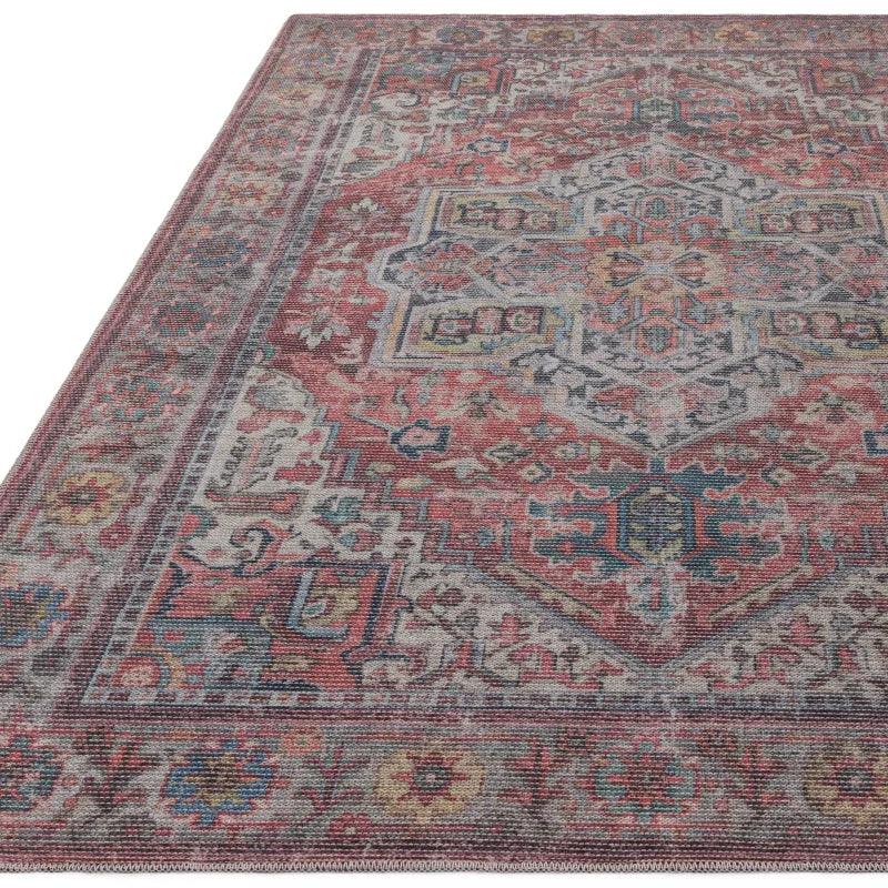 Traditional red and grey patterned area rug with intricate geometric and floral designs
