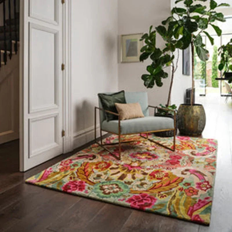 Floral patterned rug with modern armchair and indoor plant in bright living room