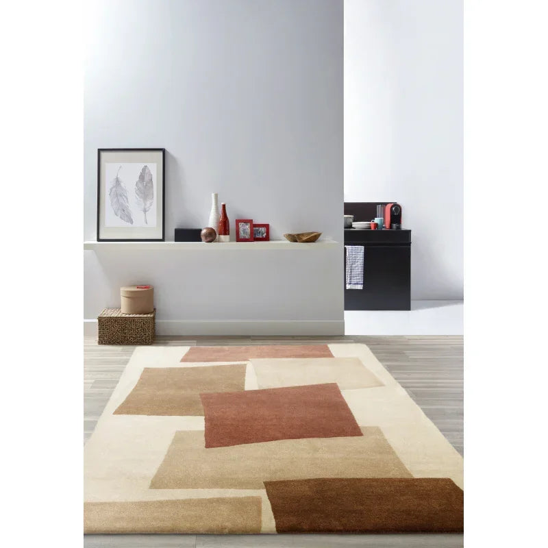 Modern geometric area rug in beige and brown tones on wood floor in contemporary living space