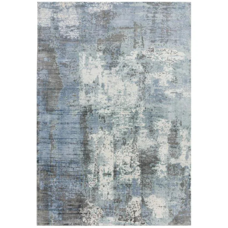 Abstract blue and grey rug with textured pattern and soft pile