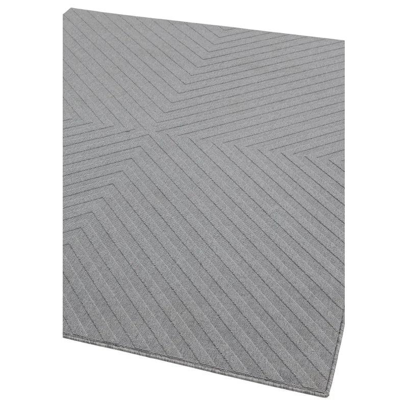 Light grey textured rug with chevron pattern, corner angle view