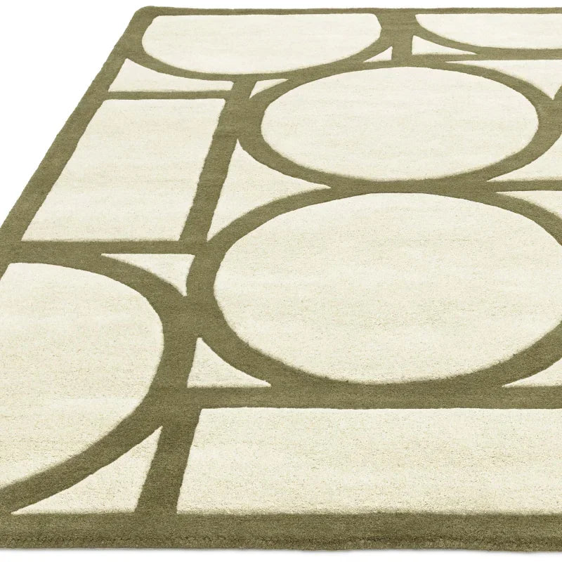 Cream and olive green geometric rug with large circles and lines, corner angle view