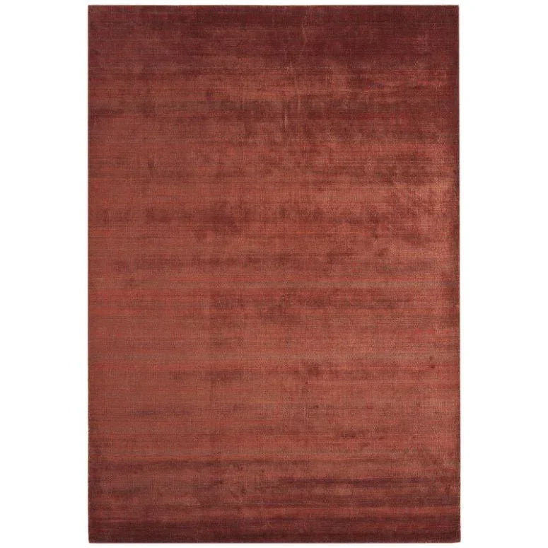 Large plain red area rug with subtle texture and plush finish