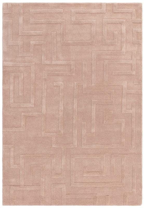 Beige geometric rug with raised pattern and soft textured surface