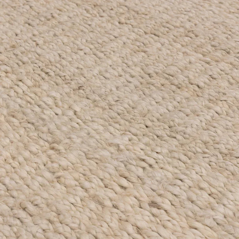 Close up of natural woven jute rug texture in beige