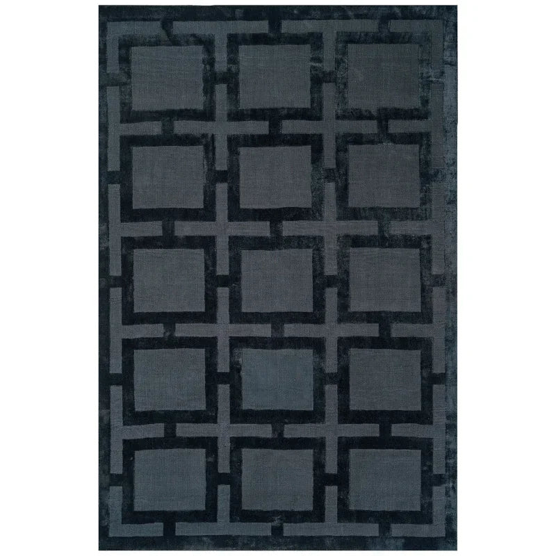 Dark grey geometric rug with square lattice pattern and velvety texture