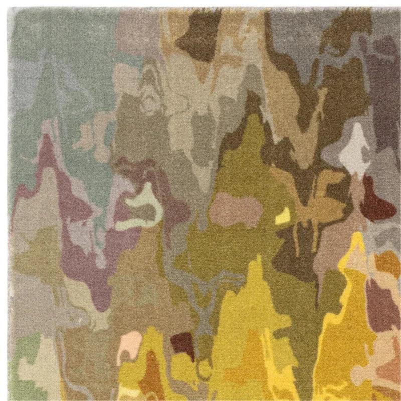 Multicoloured abstract pattern rug with muted green, yellow, and brown tones