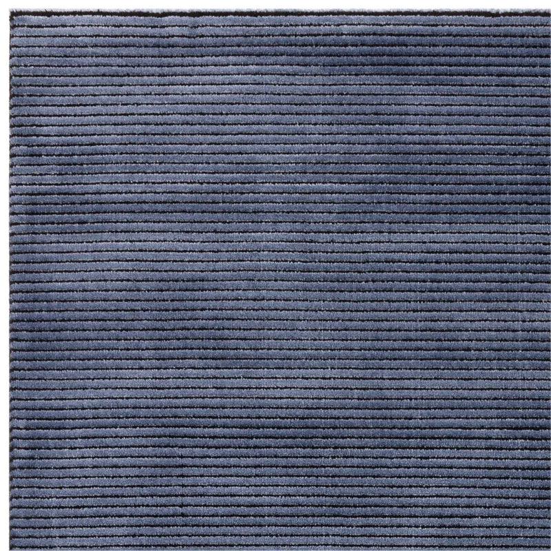 Navy blue corded rug with horizontal textured lines, close up of fabric detail