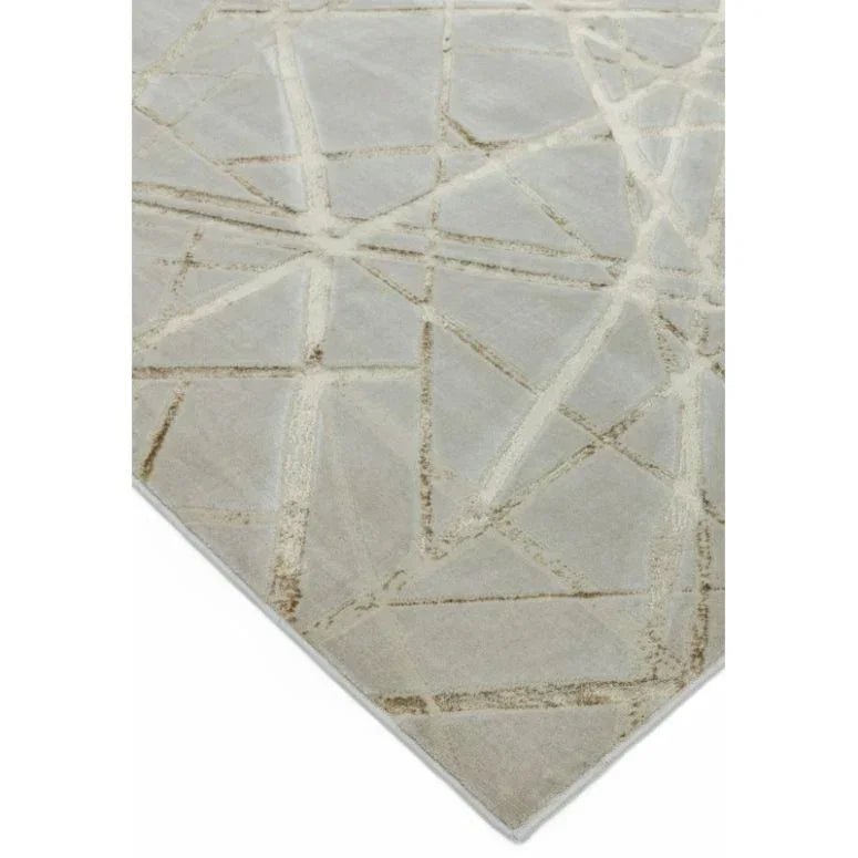 Beige area rug with geometric line pattern and soft textured surface, angled corner view