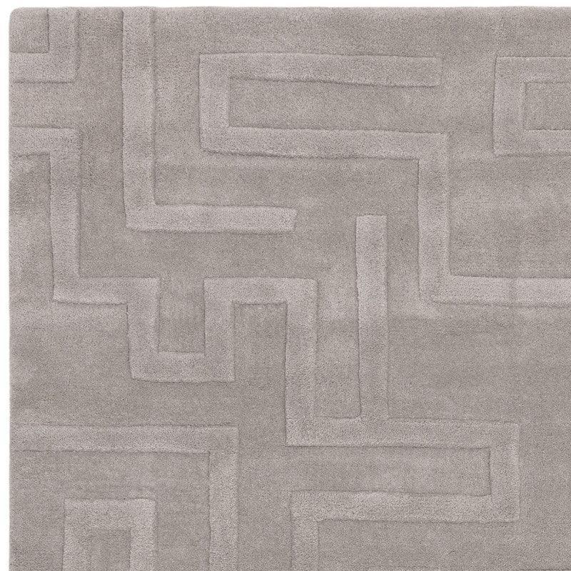 Grey rug with geometric embossed pattern and soft textured finish