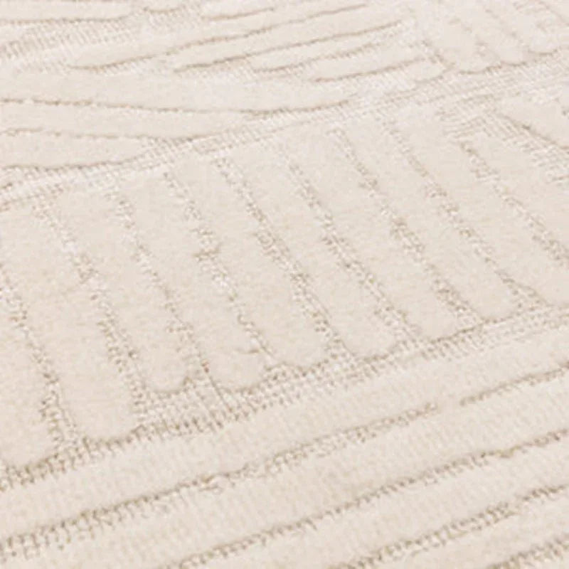 Textured cream rug with geometric pattern and soft pile, close-up detail view