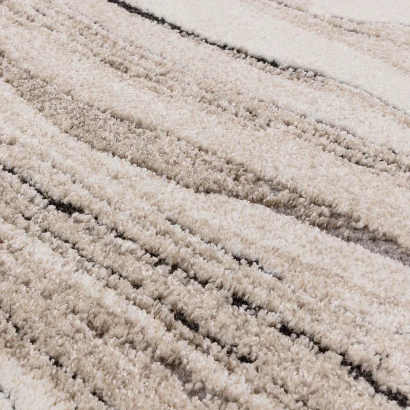Beige shaggy rug with soft textured stripes and high-pile detail
