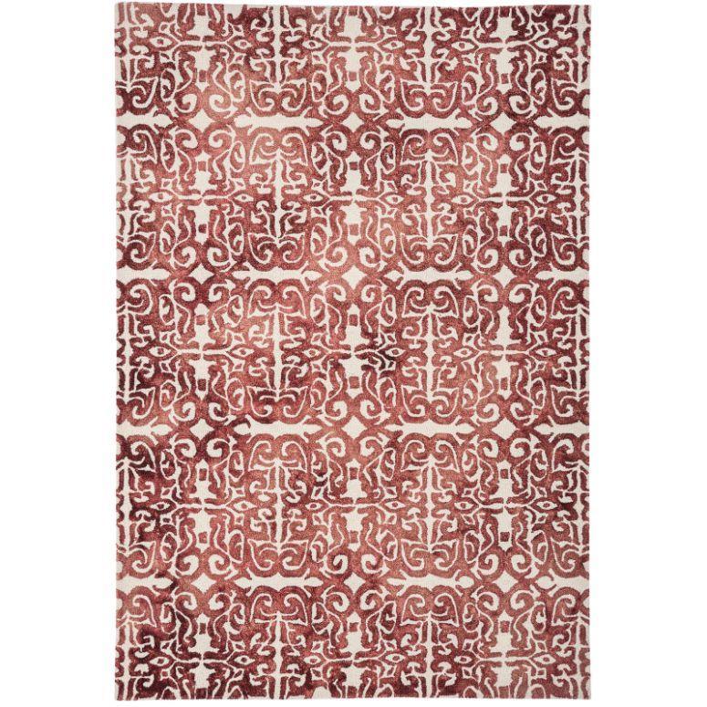 Red and cream patterned rug with intricate geometric design