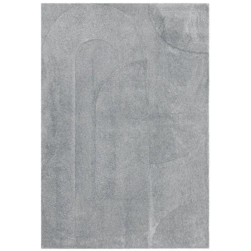 Light grey area rug with subtle geometric pattern and soft textured finish