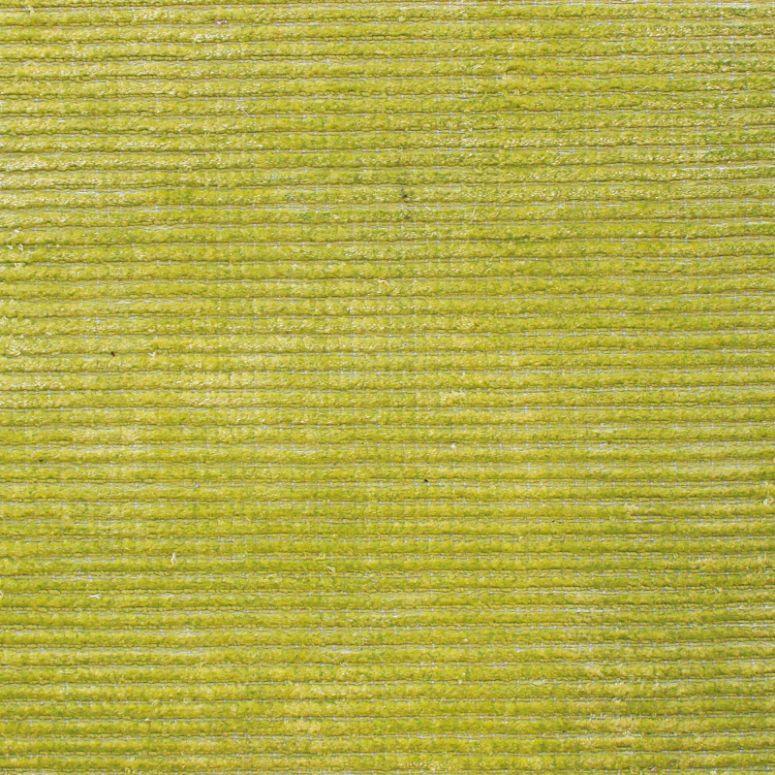Closeup of green corduroy fabric texture, ideal for upholstery or sofa material