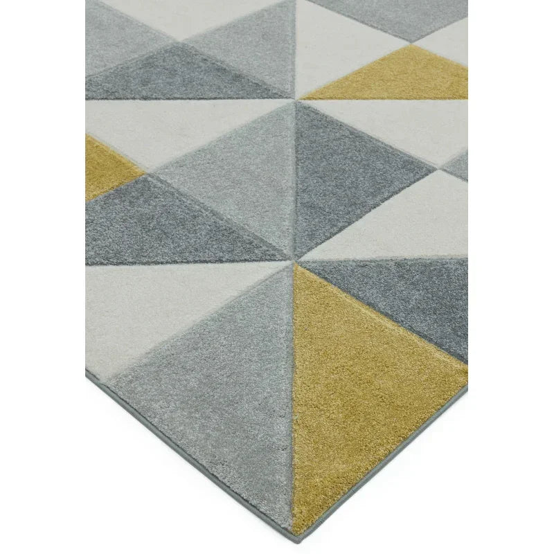 Modern geometric rug with grey, white, and mustard yellow triangle pattern