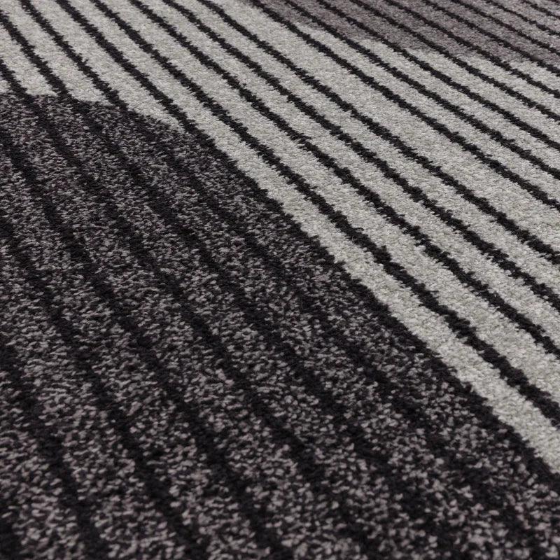 Grey and black striped carpet texture close up showing pile detail