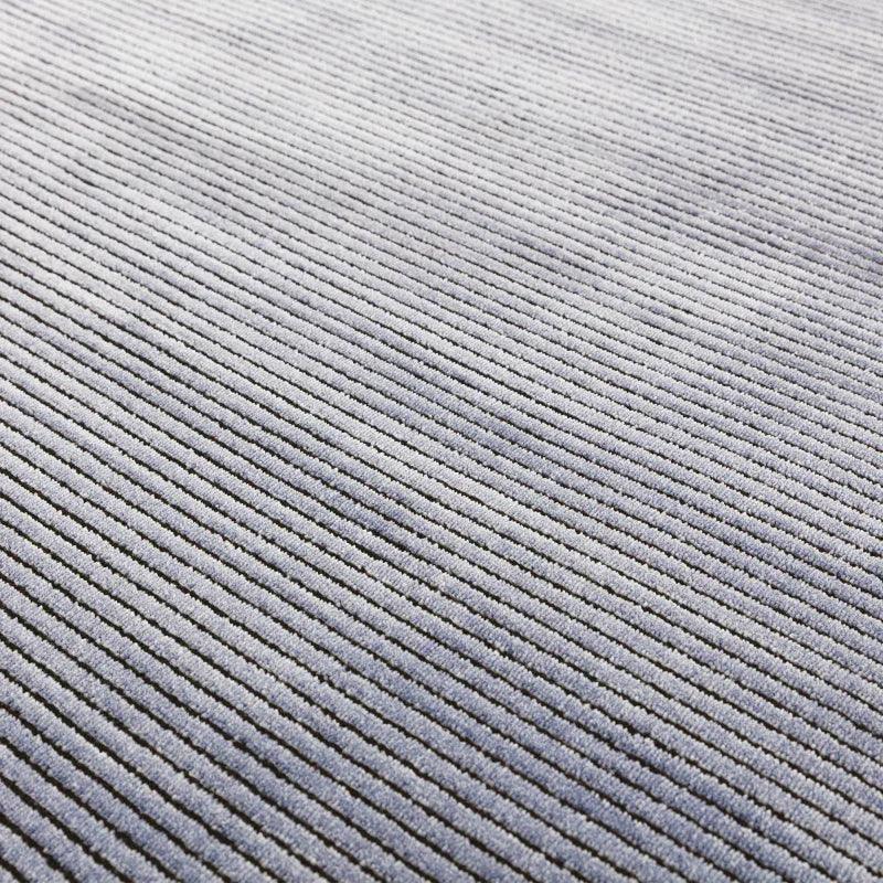 Close up of grey corduroy sofa fabric with linear textured pattern