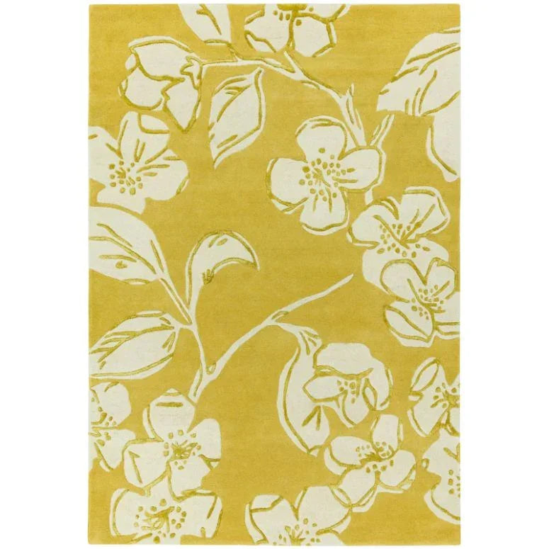 Yellow floral area rug with white flower and leaf pattern