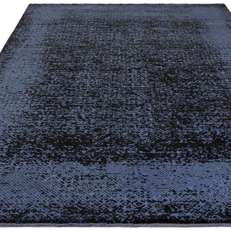 Blue and black patterned area rug with subtle textured design