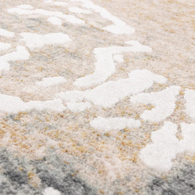 Close up of textured area rug with cream, grey and beige abstract pattern