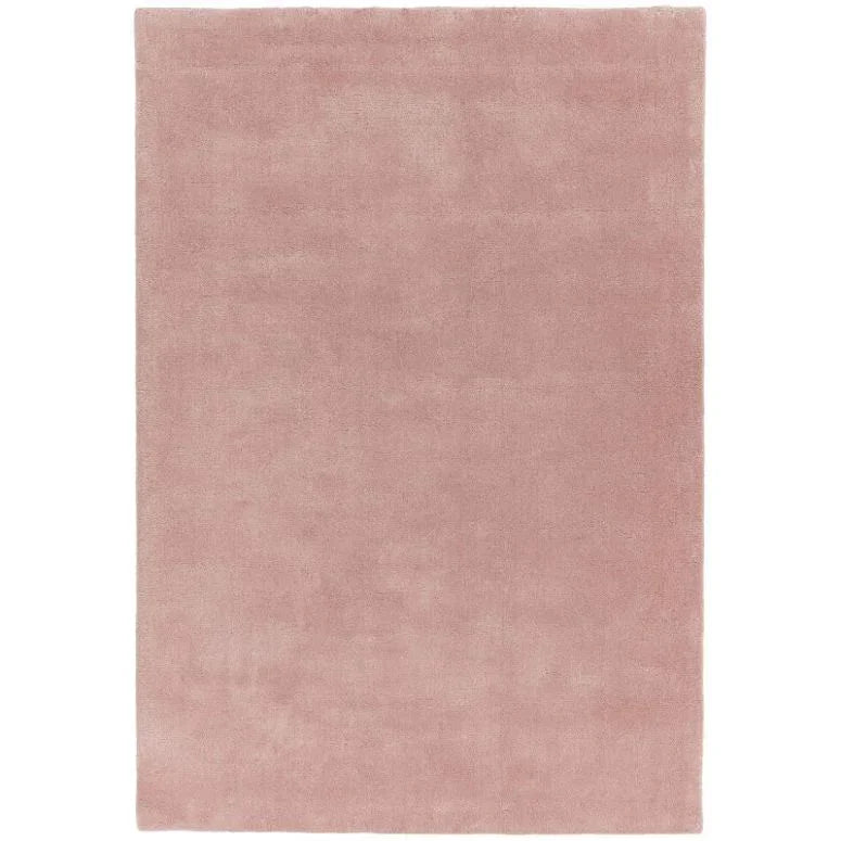 Plain pink area rug with a soft, plush texture and rectangular shape