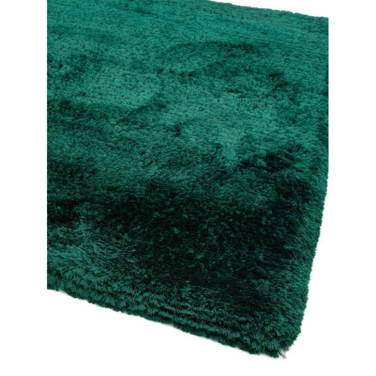 Close-up of emerald green shaggy rug with thick soft pile