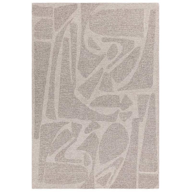 Beige area rug with abstract geometric pattern and textured pile, shown from overhead view