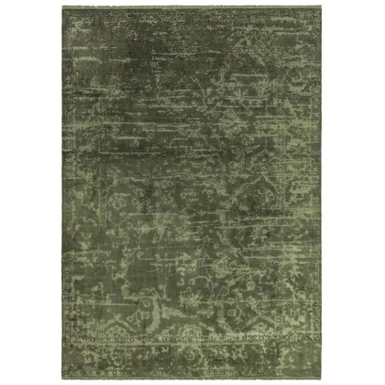Green area rug with distressed vintage pattern and subtle textured detailing