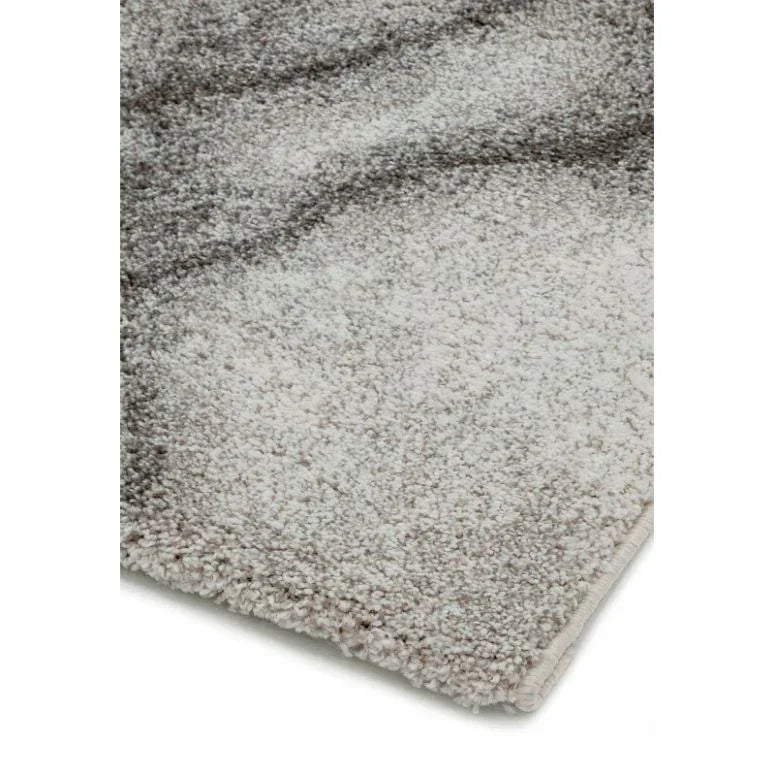 Grey and white shaggy rug corner showing soft textured pile