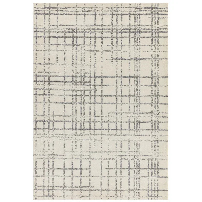 cream area rug with grey crisscross pattern and textured design