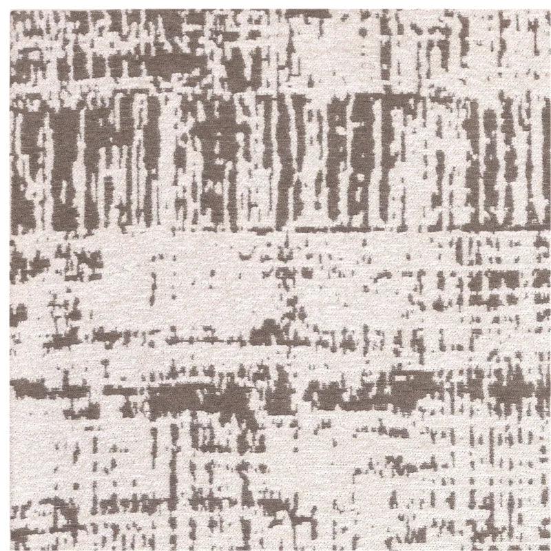 Beige and brown abstract patterned rug closeup showing textured surface and modern design