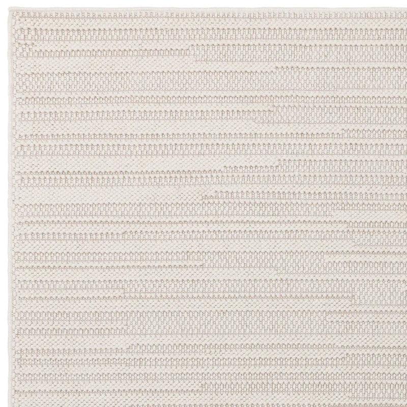 Textured cream woven rug with linear stripe pattern and finished edge