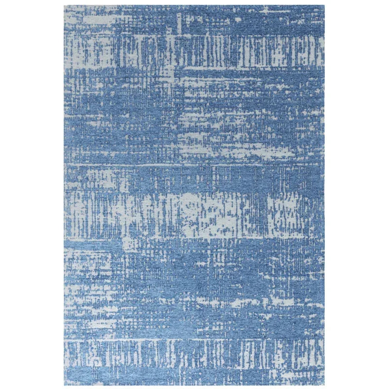 Blue patterned area rug with abstract textured design