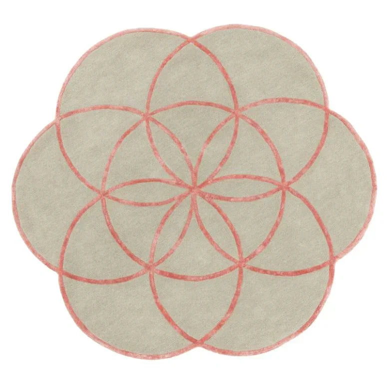 Round beige rug with pink geometric petal pattern, soft texture, top view