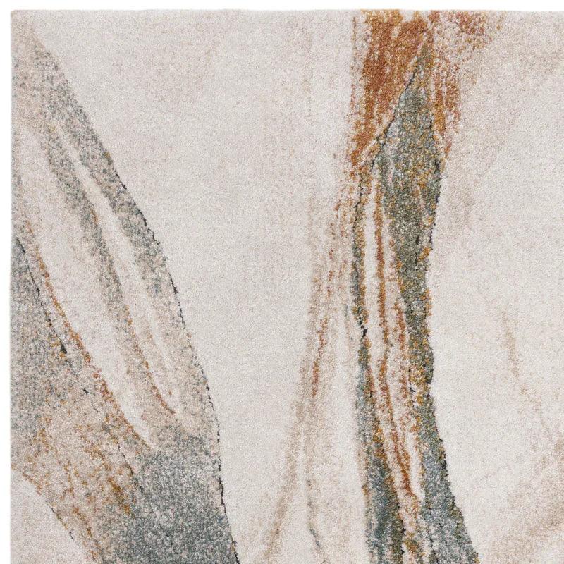 Modern area rug with abstract beige, grey, and rust pattern, close-up texture view