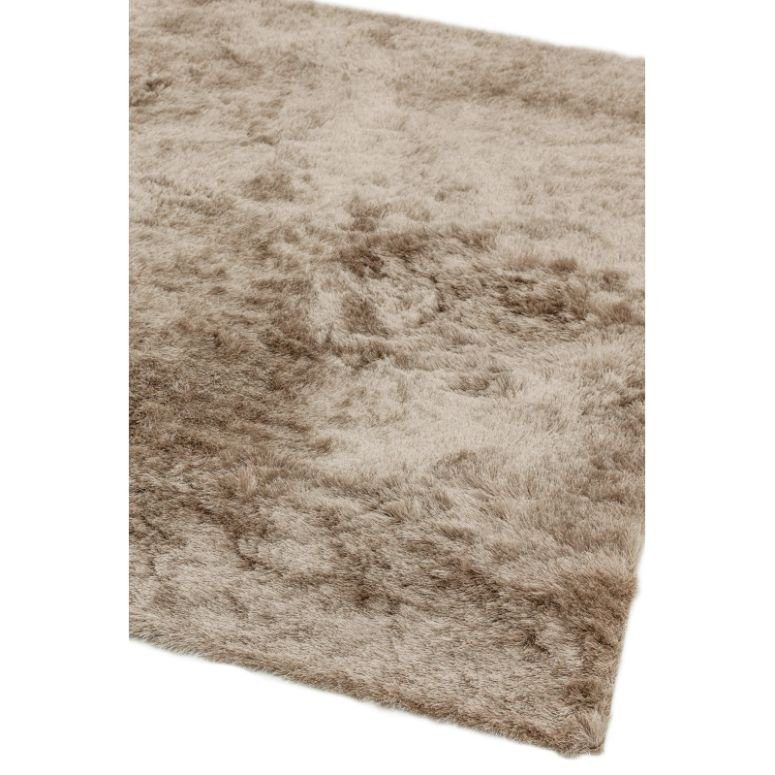 Beige shaggy rug with soft textured pile and angled corner view