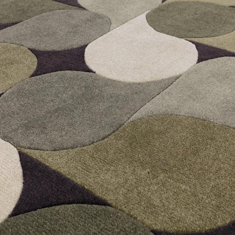 Modern area rug with abstract geometric pattern in green, beige, and grey tones