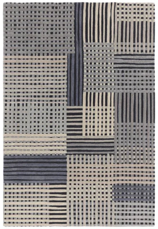 Grey patterned area rug with geometric grid design and striped sections