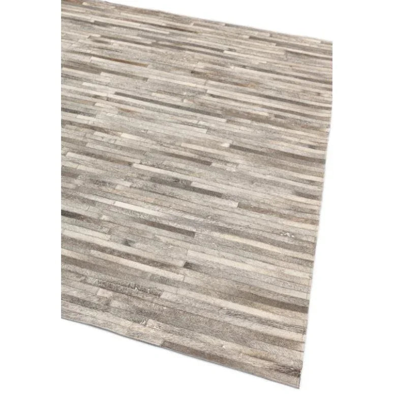 Rectangular grey area rug with linear striped pattern, angled corner view