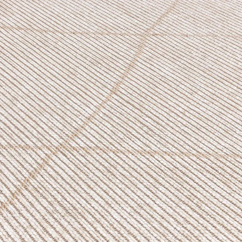 Beige ribbed textured rug with diagonal line detail in close-up view