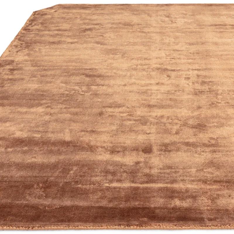 Large rectangular brown rug with a soft, plush texture and subtle color gradients