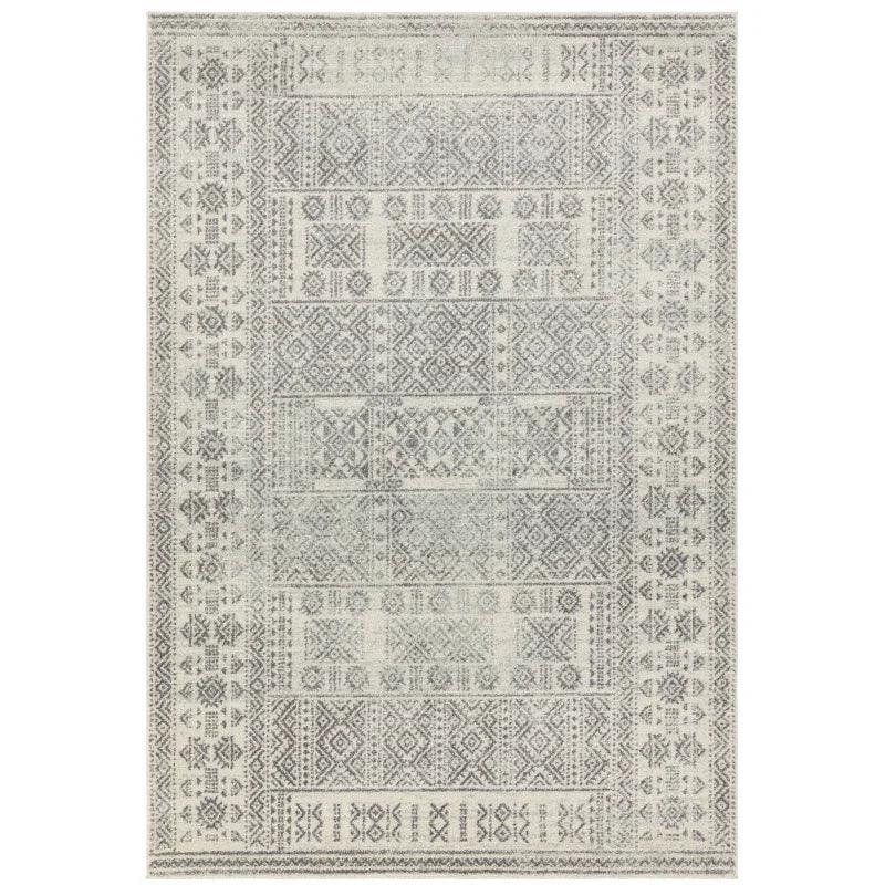 Grey geometric patterned area rug with intricate border and central motifs