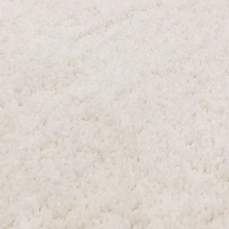 Close-up of white shaggy rug texture for living room or bedroom flooring