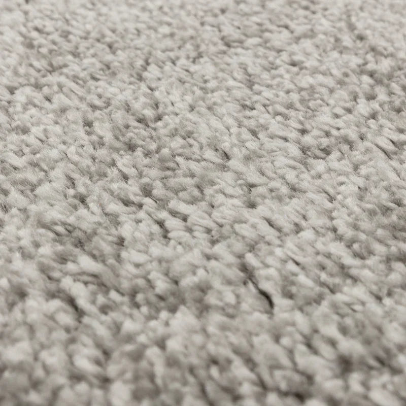 Closeup of soft grey carpet texture with dense pile
