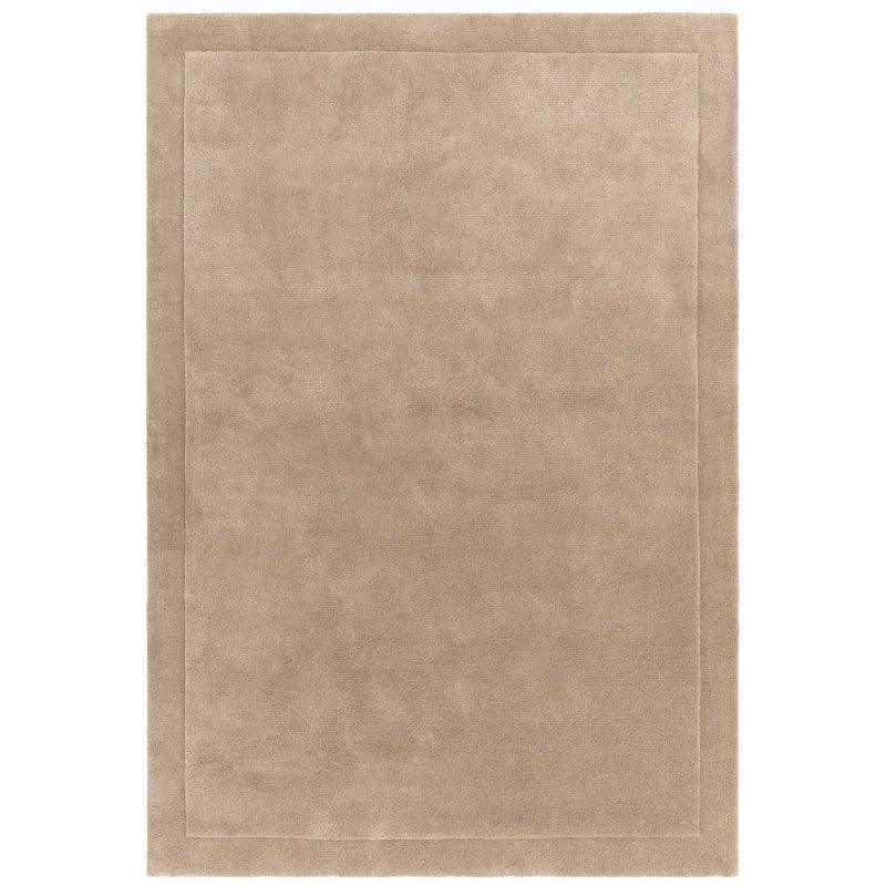 Beige wool area rug with subtle border design and soft texture, shown from above