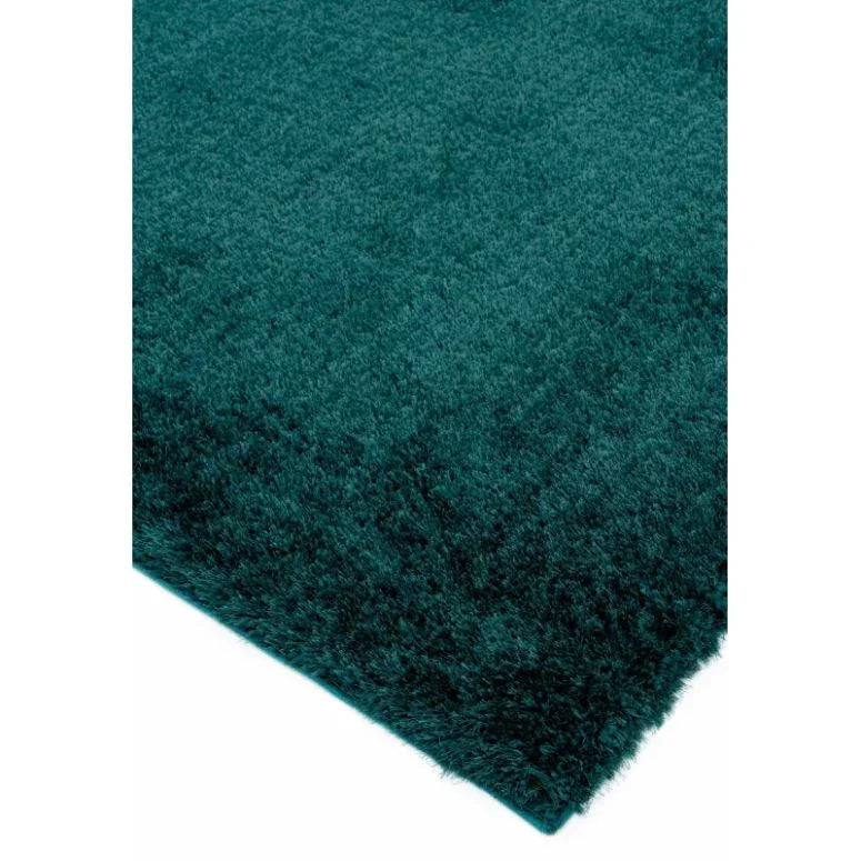 Teal shaggy rug corner with dense pile and soft texture