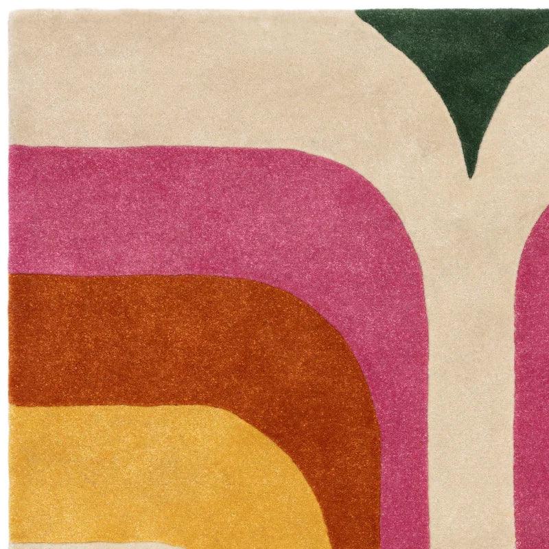 Retro style area rug with curved beige, pink, rust and yellow geometric pattern