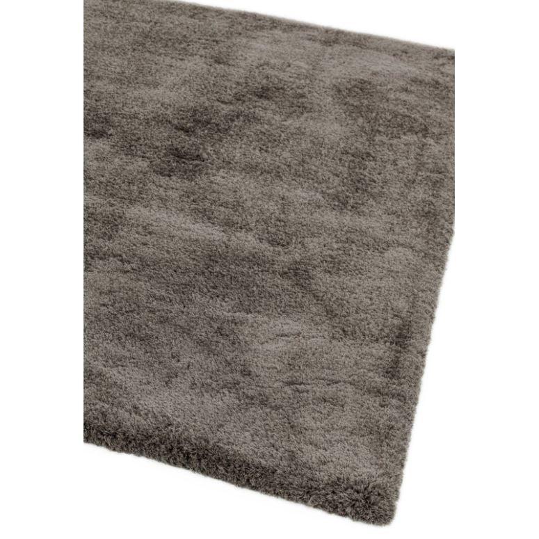 Grey shaggy rug with plush texture, shown from an angled corner view